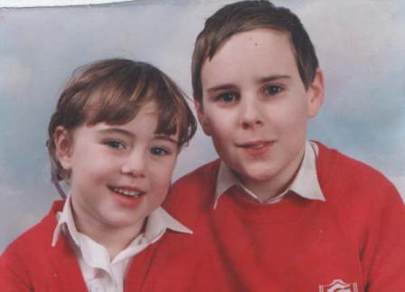Emma aged 4 and Andrew aged 10 at school together