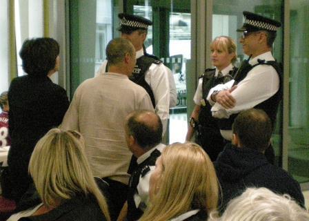 q_christine_surrounded_by_police